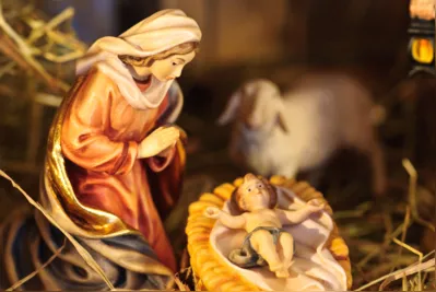 nativity scene with hand-colored figures made out of wood