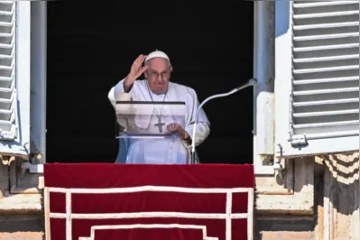 Pope Francis waves from the window of the apostolic palace during the weekly Angelus prayer on March 12, 2023 in The Vatican. (Photo by Tiziana FABI / AFP)