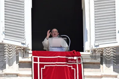 Pope Francis addresses the crowd from the window of the apostolic palace overlooking St.Peter's square during his Angelus prayer at the Vatican on September 10, 2023. (Photo by Alberto PIZZOLI / AFP)