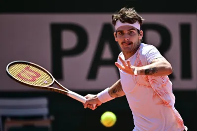 Brazil's Thiago Seyboth Wild plays a forehand return to Japan's Yoshihito Nishioka during their men's singles match on day seven of the Roland-Garros Open tennis tournament at the Court Simonne-Mathieu in Paris on June 3, 2023. (Photo by JULIEN DE ROSA / AFP)
