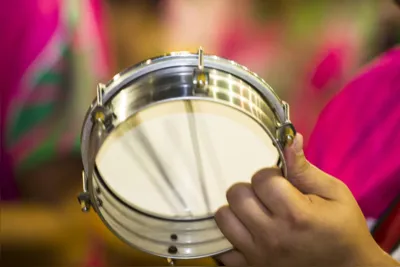 FlorianÃ³polis, Santa Catarina, Brazil - January 19, 2015: Samba dancer Playing tamborim, a small percussion instrument, during the training for the official parade next month