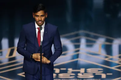 Botafogo midfielder Guilherme Madruga speaks on stage after receiving The FIFA Puskás Award during the Best FIFA Football Awards 2023 ceremony in London on January 15, 2024. (Photo by Adrian DENNIS / AFP)