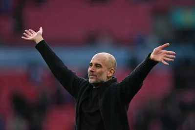 Manchester City's Spanish manager Pep Guardiola celebrates on the pitch after the English FA Cup semi-final football match between Manchester City and Chelsea at Wembley Stadium in north west London on April 20, 2024. Manchester City won the game 1-0. (Photo by Ben Stansall / AFP) / NOT FOR MARKETING OR ADVERTISING USE / RESTRICTED TO EDITORIAL USE