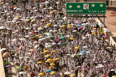 Muslim pilgrim arrive to perform the symbolic 'stoning of the devil' ritual during the annual hajj pilgrimage in Mina on June 16, 2024. Friends and family searched for missing hajj pilgrims on June 19 as the death toll at the annual rituals, which were carried out in scorching heat, surged past 900. (Photo by Fadel SENNA / AFP)