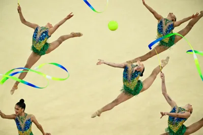 Brazil's gymnasts perform with ribbons and balls as they compete in the rhytmic gymnastics' group all-around qualification during the Paris 2024 Olympic Games at the Porte de la Chapelle Arena in Paris, on August 9, 2024. (Photo by