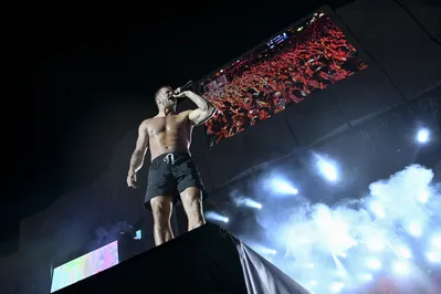 US singer Dan Reynolds of Imagine Dragons performs on the main stage of the Rock in Rio music festival at the Rio 2016 Olympic Park in Rio de Janeiro, Brazil, on September 14, 2024. (Photo by Mauro PIMENTEL / AFP)