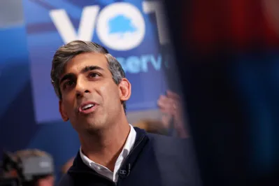 Britain's Prime Minister and Conservative Party leader Rishi Sunak delivers a speech during his final rally at Romsey Rugby Football Club, in Romsey, Hampshire, July 3, 2024 as part of a campaign event in the build-up to the UK general election on July 4. (Photo by Claudia Greco / POOL / AFP)