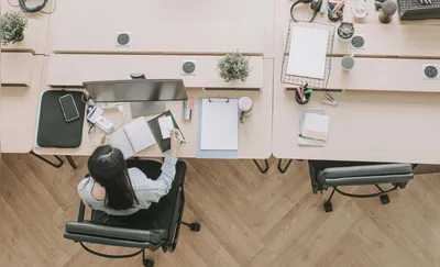 directly above asian chinese beautiful women with protective facemask working in open plan office observing with new SOP and social distancing illness prevention safety precautions