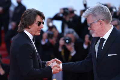 US actor and producer Tom Cruise and US film director, screenwriter Christopher McQuarrie arrive for the screening of the film "Mission: Impossible - The Final Reckoning" at the 78th edition of the Cannes Film Festival in Cannes, southern France, on May 14, 2025. (Photo by Sameer AL-DOUMY / AFP)