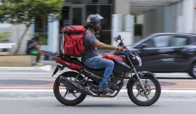 SÃ£o Paulo, SP, Brazil, MAR 12 2022, food delivery guy on Paulista avenue