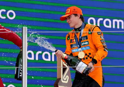 McLaren's Australian driver Oscar Piastri celebrates on the podium after winning the Formula One Spanish Grand Prix at the Circuit de Catalunya in Montmelo, on the outskirts of Barcelona, on June 1, 2025. (Photo by LLUIS GENE / AFP)