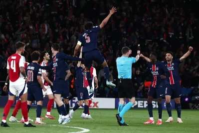 Paris Saint-Germain's Brazilian defender #05 Marquinhos (C) jumps to celebrate after Paris Saint-Germain won during the UEFA Champions League semi-final second leg football match between Paris Saint-Germain (PSG) and Arsenal at the Parc des Princes stadium in Paris, on May 7, 2025. (Photo by Thibaud MORITZ / AFP)