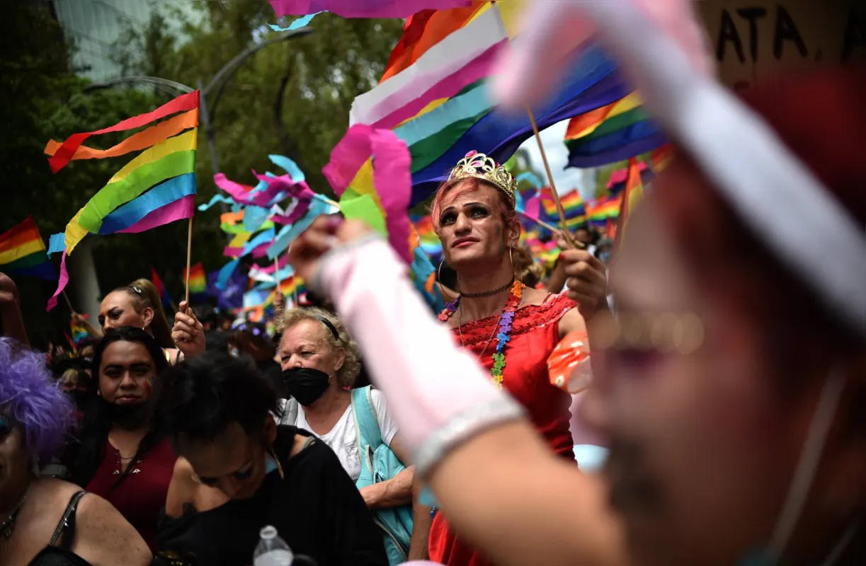 People take part in the annual Pride March in Mexico City on June 26, 2021. (Photo by Rodrigo ARANGUA / AFP)
