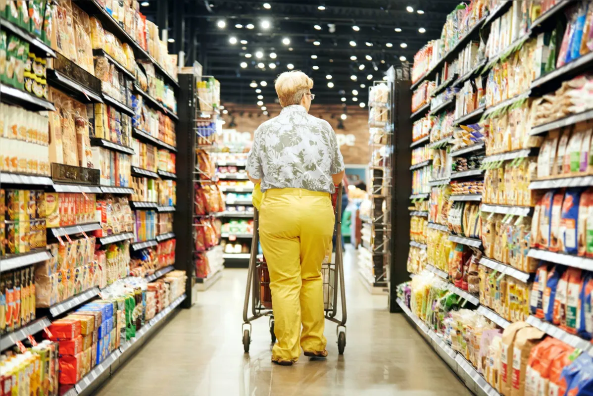 Rearview shot of a mature woman shopping in a grocery store