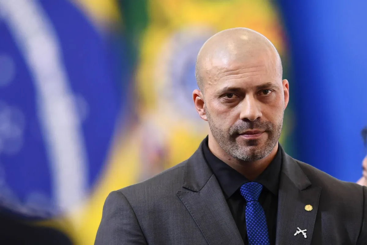 (FILES) In this file photo taken on March 31, 2022 Brazilian deputy Daniel Silveira attends the inauguration ceremony of new ministers at Planalto Palace in Brasilia. - Silveira, a pro-Bolsonaro congressman accused of promoting anti-democratic acts in Brazil, who had barricaded inside Congress in defiance of a Supreme Court judge's ruling ordering him to wear an electronic anklet, was sentenced by the Supreme Court on April 20, 2022 to eight years and nine months in prison. (Photo by EVARISTO SA / AFP)