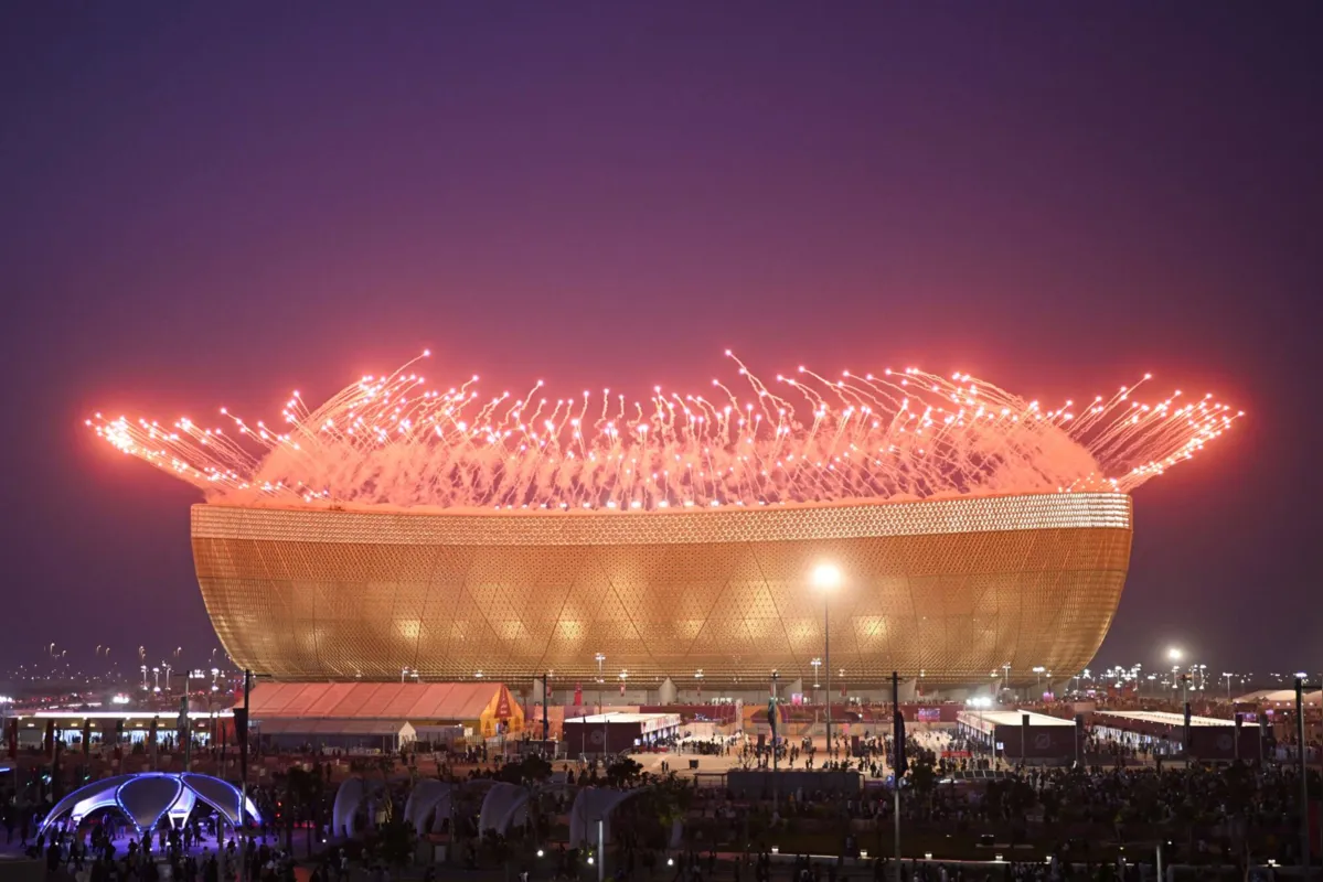 Fireworks are pictured before the start of the Qatar 2022 World Cup final football match between Argentina and France at Lusail Stadium in Lusail, north of Doha on December 18, 2022. (Photo by PATRICIA DE MELO MOREIRA / AFP)