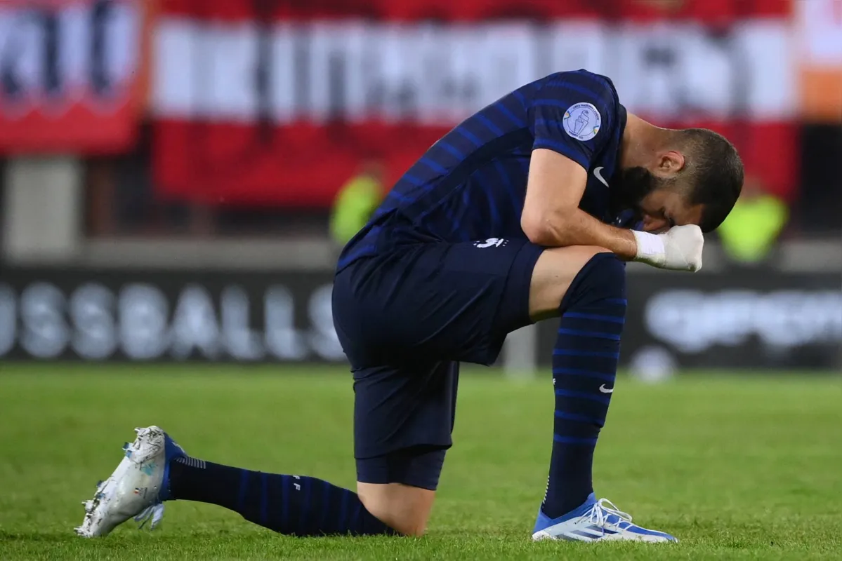 (FILES) In this file photo taken on June 10, 2022 France's forward Karim Benzema reacts after failing to score during the UEFA Nations League football match Austria v France at the Ernst Happel stadium in Vienna. - Defending champions France will not replace the injured Karim Benzema in their World Cup squad, coach Didier Deschamps said on November 20, 2022. In a huge blow to France's hopes of retaining the trophy in Qatar, Benzema was ruled out after the Ballon d'Or winner injured his left thigh in training on November 19, 2022. (Photo by FRANCK FIFE / AFP)