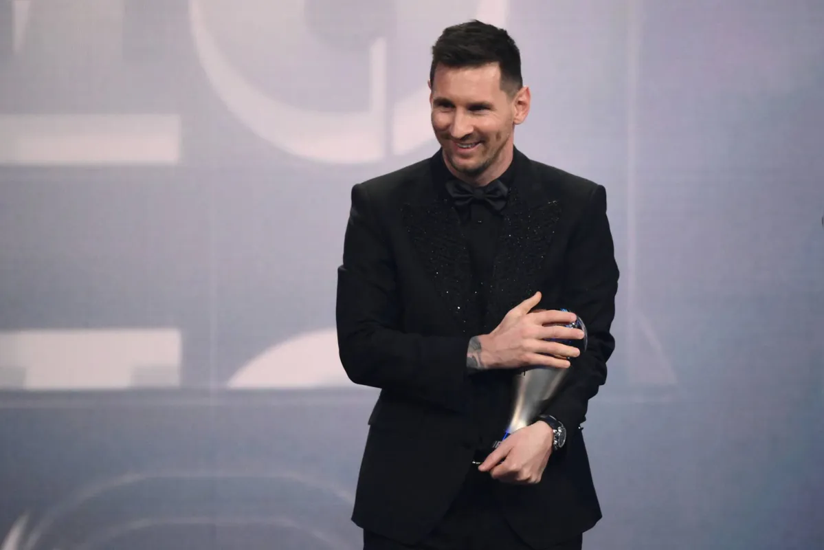 Argentina and Paris Saint-Germain forward Lionel Messi poses on stage after receiving the Best FIFA Men’s Player award during the Best FIFA Football Awards 2022 ceremony in Paris on February 27, 2023. (Photo by FRANCK FIFE / AFP)