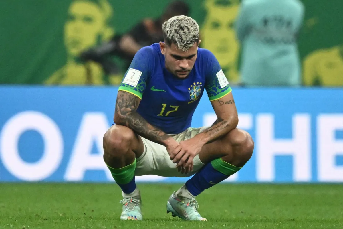 Brazil's midfielder #17 Bruno Guimaraes reacts to their defeat on the pitch after during the Qatar 2022 World Cup Group G football match between Cameroon and Brazil at the Lusail Stadium in Lusail, north of Doha on December 2, 2022. (Photo by Jewel SAMAD / AFP)