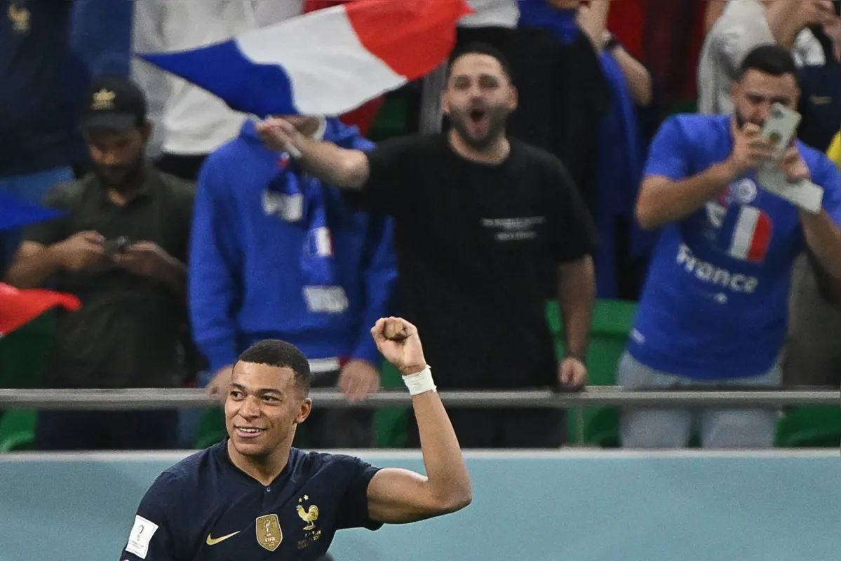 France's forward #10 Kylian Mbappe celebrates scoring his team's third goal during the Qatar 2022 World Cup round of 16 football match between France and Poland at the Al-Thumama Stadium in Doha on December 4, 2022. (Photo by ANDREJ ISAKOVIC / AFP)