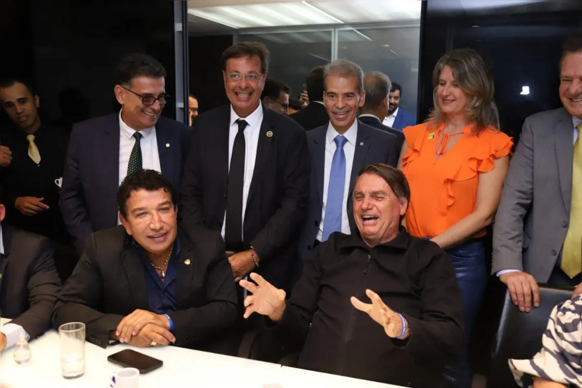This handout picture released by the Brazilian Liberal Party shows former Brazilian President Jair Bolsonaro (R) gesturing during a meeting with the party's lawmakers at the Liberal Party headquarters in Brasilia on March 30, 2023. - Three months after leaving for the United States in the final hours of his term, Brazil's ex-president Jair Bolsonaro returned home Thursday to reenter politics -- complicating life for his successor and nemesis, Luiz Inacio Lula da Silva. The far-right ex-army captain, who skipped town two days before Lula's inauguration on January 1, arrived back in Brasilia on a commercial flight from Orlando, Florida. (Photo by Handout / Liberal Party / AFP) / RESTRICTED TO EDITORIAL USE - MANDATORY CREDIT "AFP PHOTO / BRAZILIAN LIBERAL PARTY" - NO MARKETING NO ADVERTISING CAMPAIGNS - DISTRIBUTED AS A SERVICE TO CLIENTS