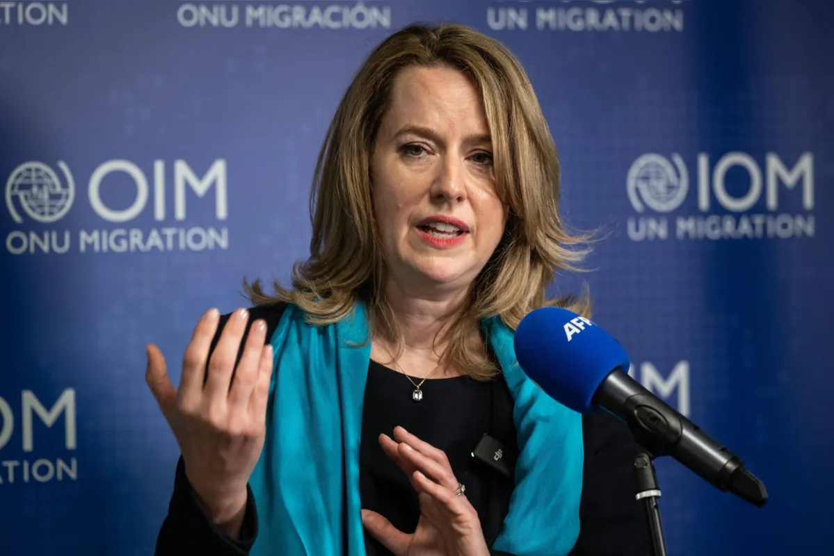 International Organization for Migration (IOM) Deputy Director-General Amy Pope of the US gestures during a press conference after being elected as new UN migration chief in Geneva, on May 15, 2023. White House veteran Amy Pope will become the first woman to head the UN's International Organization for Migration after beating her boss Antonio Vitorino in a leadership vote May 15, 2023. (Photo by Fabrice COFFRINI / AFP)