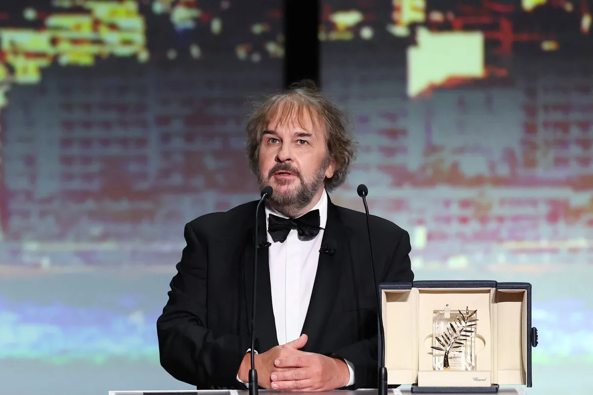 New Zealand director, screenwriter and producer Peter Jackson receives his Honorary Palme d'Or on stage during the Opening Ceremony at the 79th edition of the Cannes Film Festival in Cannes, southern France, on May 12, 2026. (Photo by Sameer AL-DOUMY / AFP)